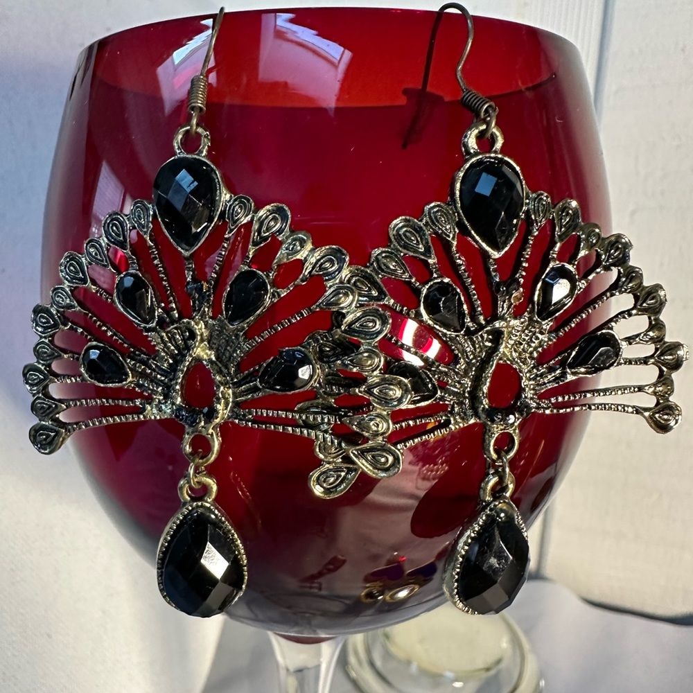 Intricate filigree style peacock earrings